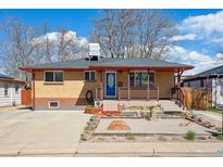 Charming brick home featuring a covered front porch and a low maintenance xeriscaped front yard at 2060 S Lowell Blvd, Denver, CO 80219