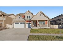 Beautiful two-story home with a two-car garage and covered porch at 315 Painted Horse Way, Erie, CO 80516
