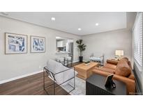 Bright living room showcasing modern decor, comfortable seating, and a stylish design with art pieces at 500 S Pennsylvania St # 520, Denver, CO 80209