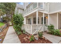 Charming condo with covered porch and a nicely landscaped yard at 12655 E Pacific Cir # E, Aurora, CO 80014