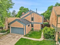 Charming home with a two-car garage and a manicured front lawn at 10222 W Ida Ave # 237, Littleton, CO 80127