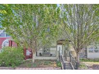 Charming two-story home with a cozy front porch and well-maintained landscaping at 2530 N Franklin St, Denver, CO 80205