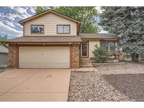 Charming two-story home featuring a two-car garage and a well-maintained front yard at 18984 E Kent Cir, Aurora, CO 80013
