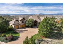 Luxury home with a large backyard and mountain views at 4479 Tierra Alta Dr, Castle Rock, CO 80104