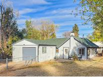 Charming single story home with attached garage and spacious yard at 274 S Newton St, Denver, CO 80219