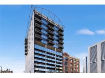 Contemporary condominium exterior showcases modern architectural design against a clear blue sky at 2020 Arapahoe St # 1130, Denver, CO 80205