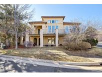Stunning two-story home with balconies and stucco exterior, offering curb appeal at 13901 E Saratoga Pl, Aurora, CO 80015