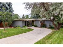Inviting single-story home with a curved driveway, mature trees, and well-maintained landscaping at 1338 S Fairfax St, Denver, CO 80222
