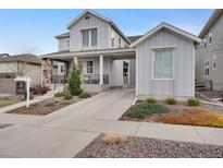 Attractive two-story home with a well-manicured front yard and a welcoming entrance, showcasing curb appeal at 9396 Bear River St, Littleton, CO 80125