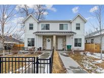 Charming townhome with a modern farmhouse design and inviting front entryways at 2840 S Bannock St, Englewood, CO 80110