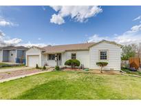 Charming single-story home with well-manicured lawn and freshly painted exterior at 1881 E 95Th Ave, Thornton, CO 80229
