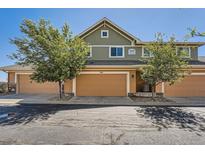 Charming townhome featuring a two-car garage and well-maintained landscaping at 3611 S Perth Cir # 103, Aurora, CO 80013