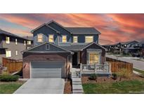 Charming two-story home with a brick and siding exterior, complemented by a well-maintained front yard at 12828 Fox Ct, Westminster, CO 80234