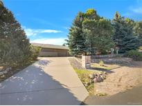 Lovely single Gathering home on a well-manicured lot featuring mature landscaping at 7292 Firethorn, Littleton, CO 80125