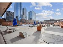 Relaxing rooftop pool and deck with city views at 1551 Larimer St # 2805, Denver, CO 80202