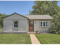 Charming home featuring a well-maintained lawn and inviting curb appeal at 1140 S Xavier St, Denver, CO 80219