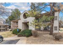 Inviting condo complex featuring well-maintained landscaping, handicap parking and a modern design in a residential neighborhood at 9680 Brentwood Way # 202, Broomfield, CO 80021