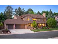 Two-story house with brown roof and landscaped yard at 7956 S Eudora Cir, Centennial, CO 80122