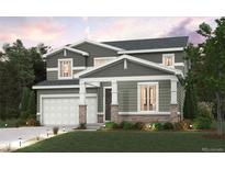Charming two-story home featuring a two-car garage, stone accents, and a well-manicured lawn at 1415 Orchard St, Brighton, CO 80601