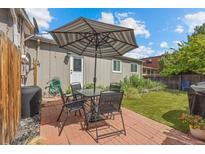 Relaxing backyard with patio furniture and artificial turf at 1217 Osceola St, Denver, CO 80204