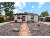 Charming single-story home featuring a well-maintained front yard and decorative rock landscaping at 5445 Reed Ct, Arvada, CO 80002