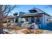 View of a single-Gathering home featuring a covered porch, yard, and classic architectural details at 4059 Quivas St, Denver, CO 80211