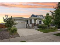 Charming single-Gathering home with a well-manicured lawn, two car garage and inviting front porch at 5928 N Odessa St, Aurora, CO 80019