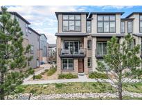 Modern townhome featuring a private balcony and stylish architectural details at 522 Meridian Ln, Superior, CO 80027