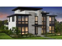Modern home featuring black-framed windows, white siding, and stone accents with professionally landscaped grounds at 2758 Utica St, Denver, CO 80212