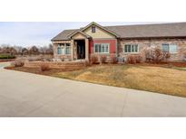 Charming single-story home featuring stone accents and a well-maintained front yard at 12717 Madison Ct, Thornton, CO 80241
