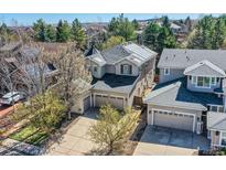 Charming two-story home with a three-car garage, solar panels and mature landscaping at 10908 Oakshire Ave, Highlands Ranch, CO 80126