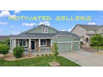 Charming single-Gathering home featuring a well-manicured lawn and a welcoming front porch at 42013 Big Horn Cir, Elizabeth, CO 80107