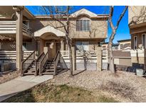 Charming townhome with a quaint entrance, featuring a well-maintained yard and inviting curb appeal at 4548 E Kentucky Cir, Denver, CO 80246