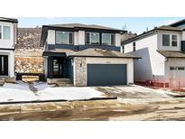 Beautiful two-story home with a two-car garage and stone accents at 4819 Daven Rd, Morrison, CO 80465