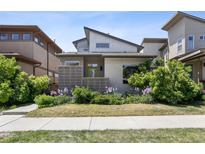 Charming home with modern architectural details and a beautifully landscaped front yard at 6735 Avrum Dr, Denver, CO 80221