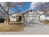Charming single-Gathering home with a two-car garage and a well-manicured front yard in a quiet neighborhood at 22815 E Progress Ave, Aurora, CO 80015