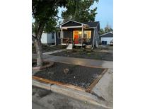 Charming craftsman style home with landscaping and a welcoming front porch at 3736 S Lincoln St, Englewood, CO 80113