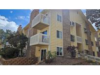Condo building with brick accents and multiple balconies at 12450 E Cornell Ave # 101, Aurora, CO 80014