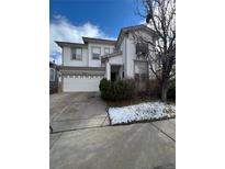 Charming two-story home featuring a well-kept lawn and a spacious two-car garage at 10638 Cherrybrook Cir, Highlands Ranch, CO 80126