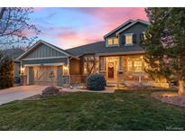 Charming two-story home with stone accents, a cozy front porch and professional landscaping at 24547 E Easter Pl, Aurora, CO 80016