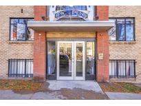 Building entrance featuring double doors, brick accents, and modern details at 500 E 11Th Ave # 402, Denver, CO 80203