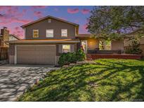 Beautiful home with well-kept lawn, two-car garage, brick details, and a cozy front porch at 6132 W 113Th Ave, Westminster, CO 80020