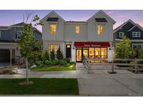 Charming two-story home featuring a well-manicured lawn and inviting front entrance at 13326 Blue Amber Ct, Parker, CO 80134