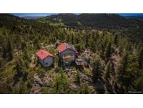 Beautiful home and guest house nestled among the trees on the mountain at 3945 Douglas Mountain Dr, Golden, CO 80403