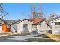Charming single-story home with a well-maintained lawn and walkway, nestled in a quiet neighborhood at 4518 Elm Ct, Denver, CO 80211