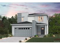 Stunning two-story home featuring a modern design, attached two car garage, and professional landscaping at 19079 E 94Th Pl, Commerce City, CO 80022