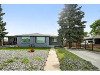 Charming single-story home with a gray exterior, well-maintained lawn, and mature landscaping at 475 S Eliot St, Denver, CO 80219