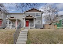Charming two-story townhome with a red front door and inviting curb appeal at 2283 S Bannock St, Denver, CO 80223