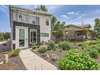 Contemporary home with front yard landscaping, balcony and modern design at 3850 Vallejo St, Denver, CO 80211
