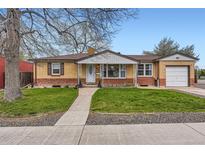 Charming brick ranch-style home with a well-manicured front yard and an attached one-car garage at 1860 W Crestline Dr, Littleton, CO 80120
